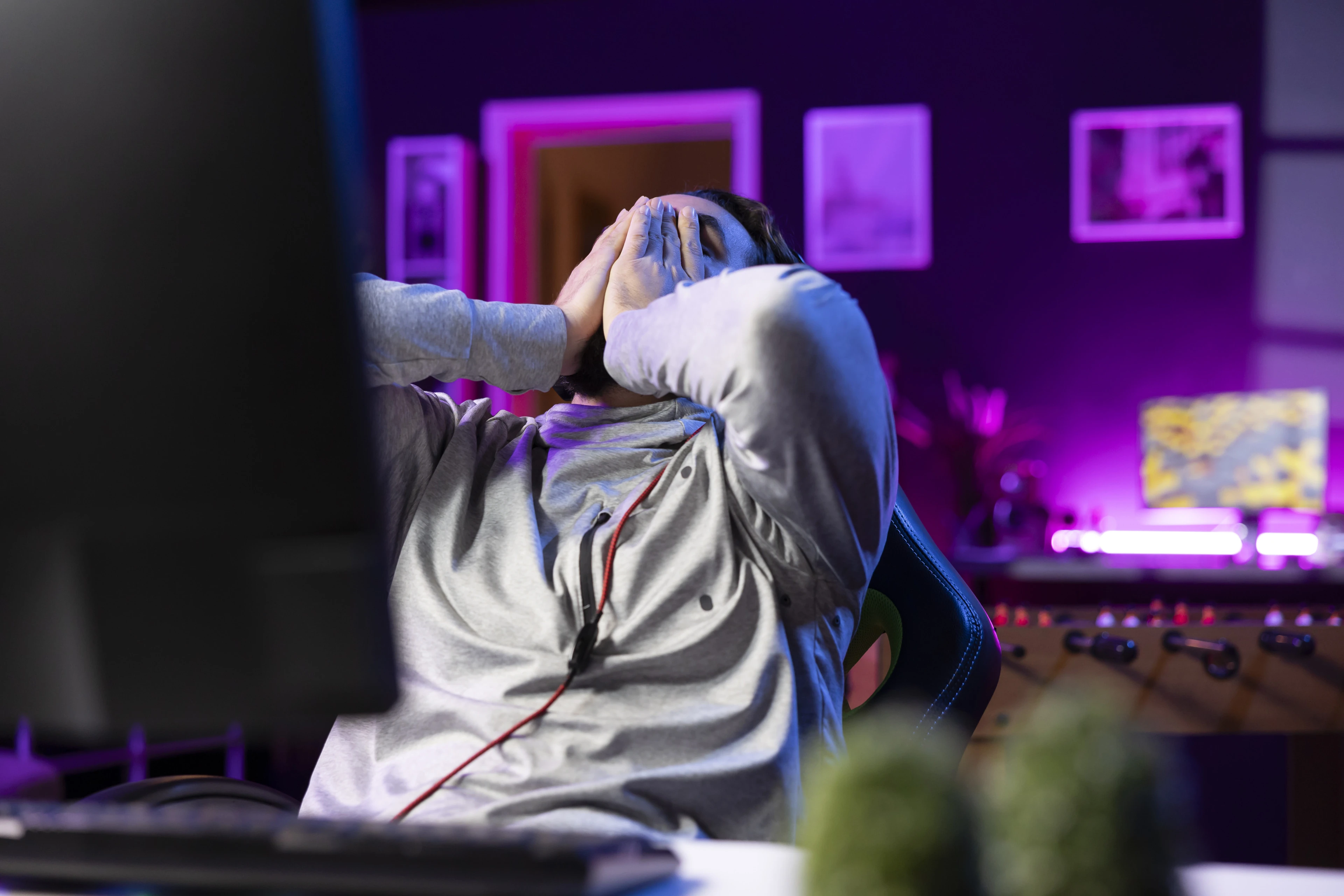 player-upset-after-losing-videogame-putting-face-hands-frustration.jpg
